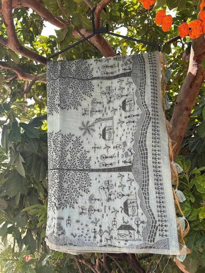 A sea blue earthy shade with warli art cotton saree