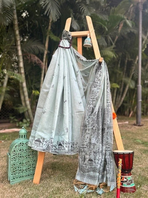A sea blue earthy shade with warli art cotton saree