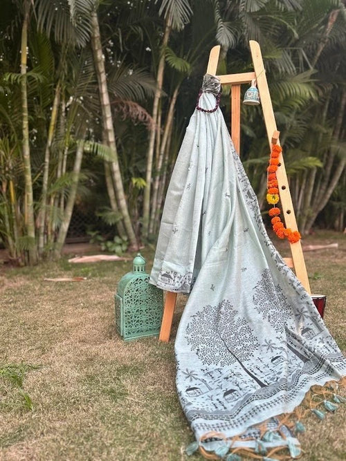 A sea blue earthy shade with warli art cotton saree