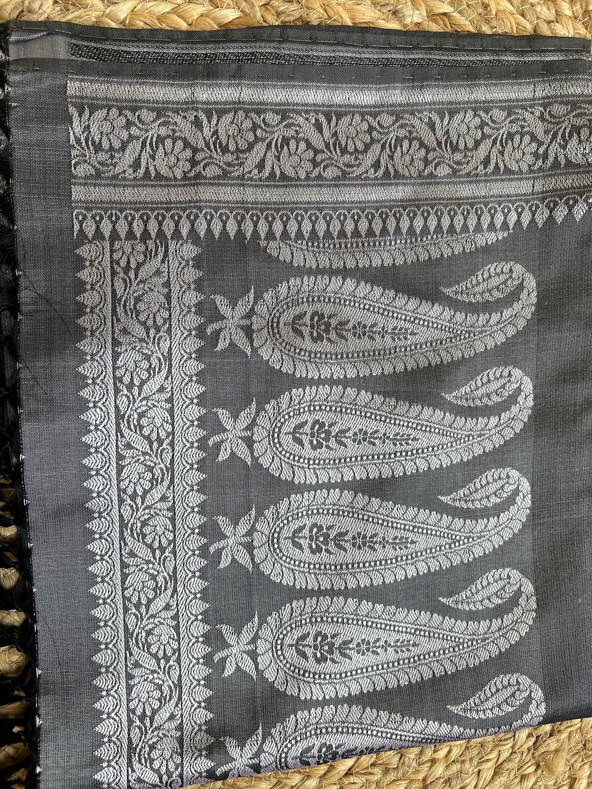 Grey with silver motifs and black tassels stole